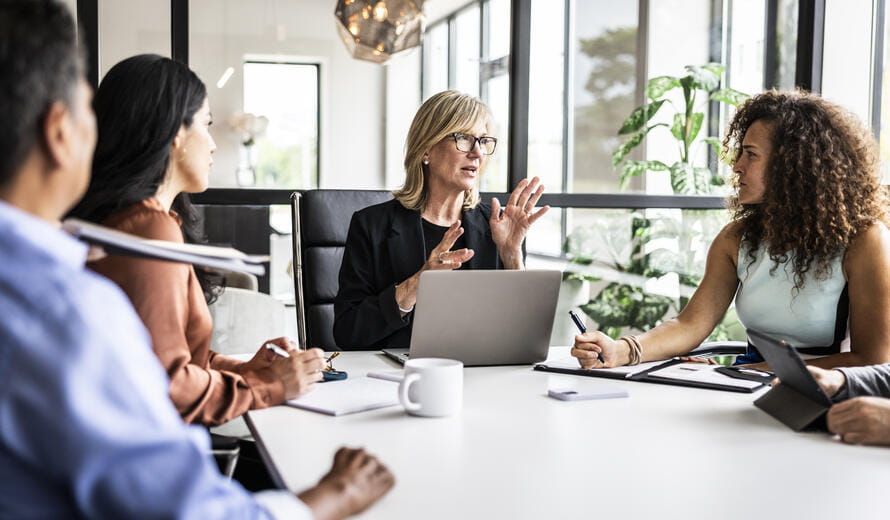 Business colleagues meeting in modern conference room